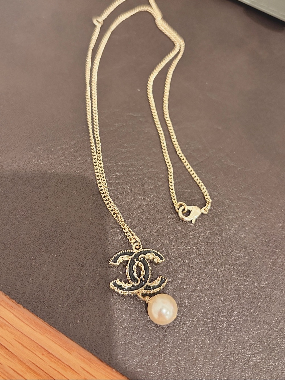 CHANEL Gold-Tone CC Logo Necklace with Pearl Drop